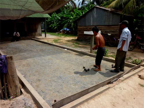 playing bool outside the rock quarry in kampot