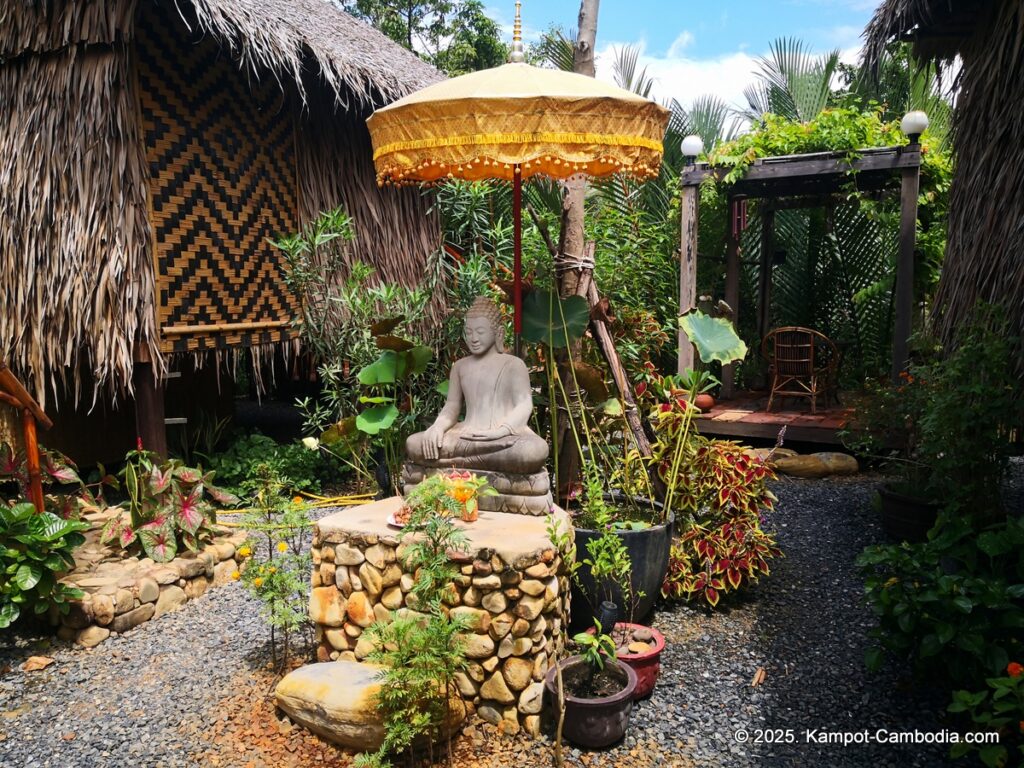 village life kampot cambodia. traditional bungalows.