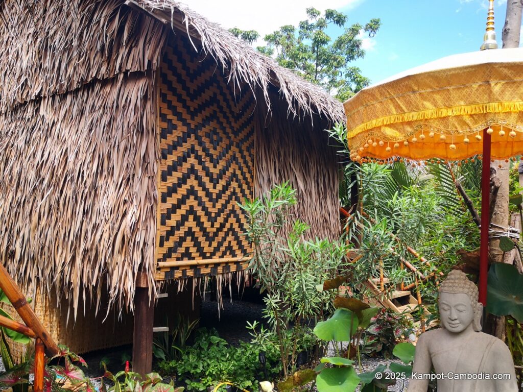 village life kampot cambodia. traditional bungalows.