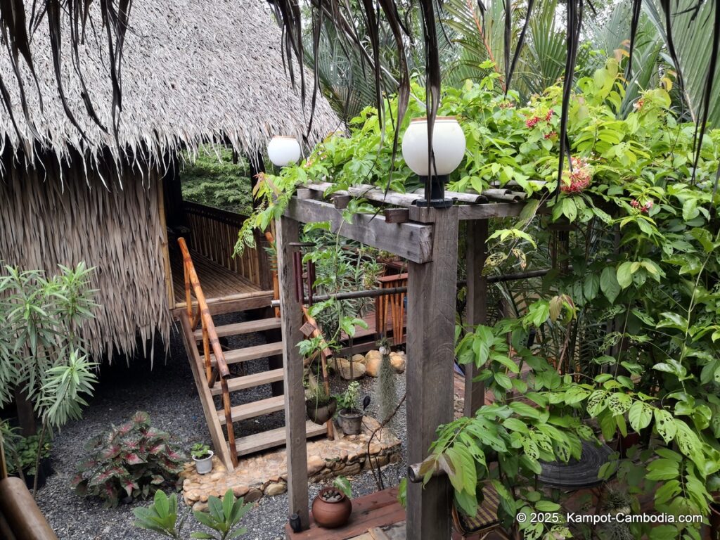 village life kampot cambodia. traditional bungalows.