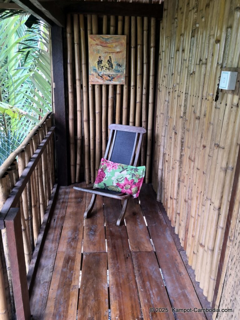 village life kampot cambodia. traditional bungalows.