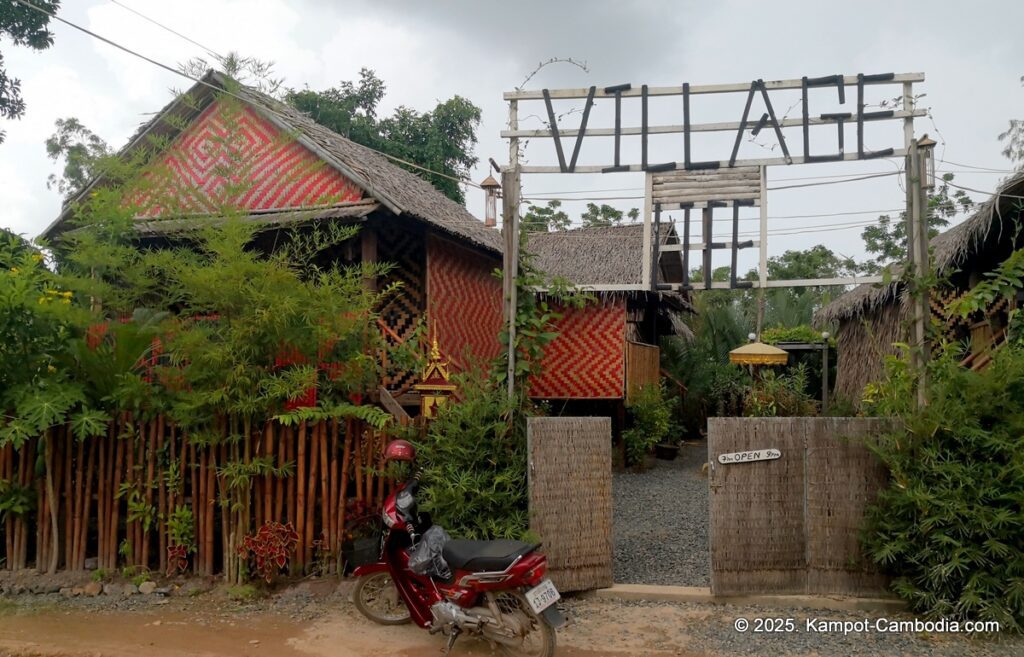 village life kampot cambodia. traditional bungalows.