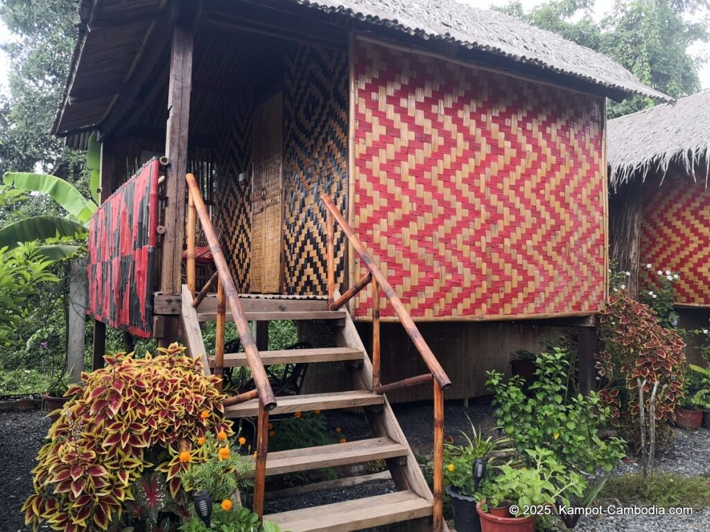 village life kampot cambodia. traditional bungalows.