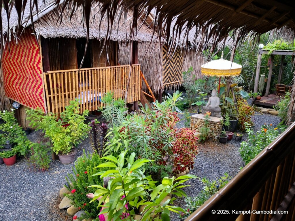 village life kampot cambodia. traditional bungalows.