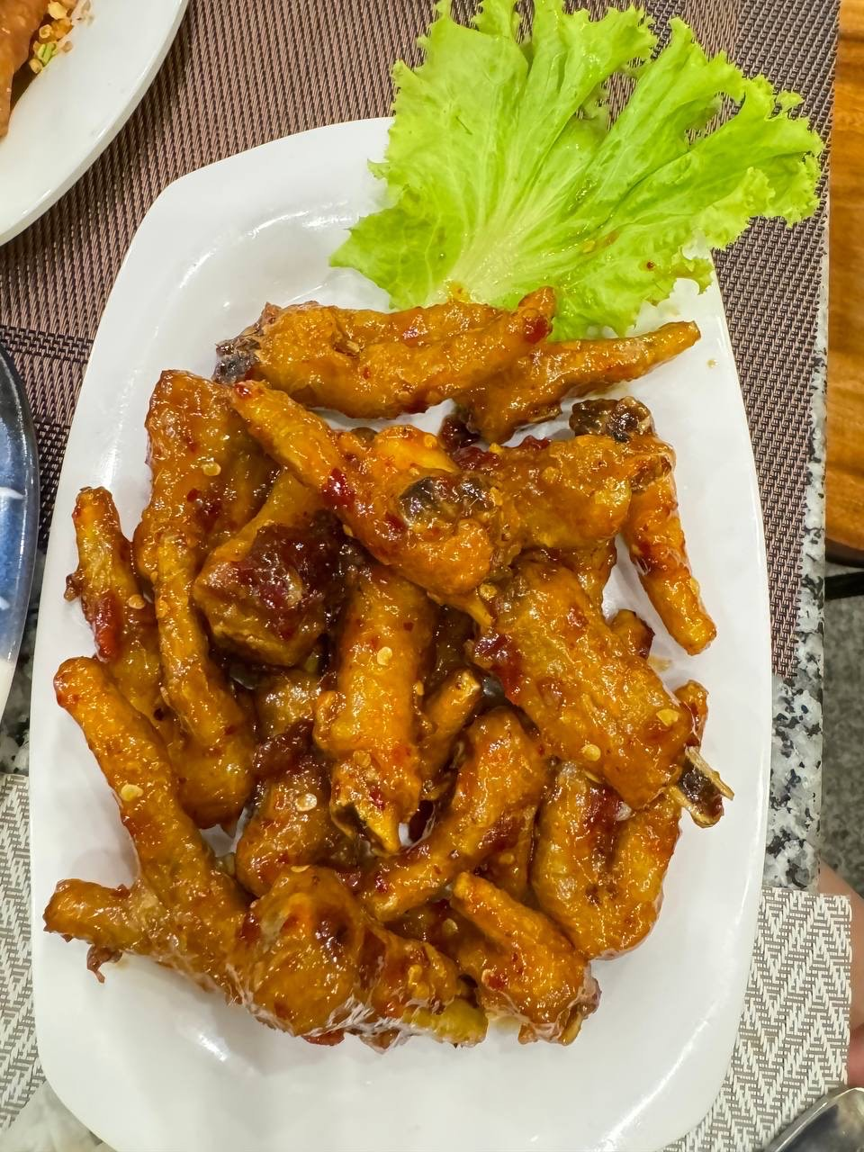 Fried chicken feet with special sauce.