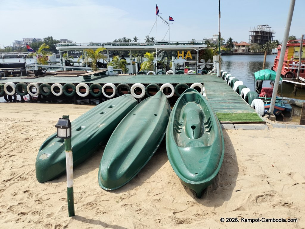 AHHA Floatel Library, hammocks, tents, cafe, kayaks on the Kampot River in Cambodia.