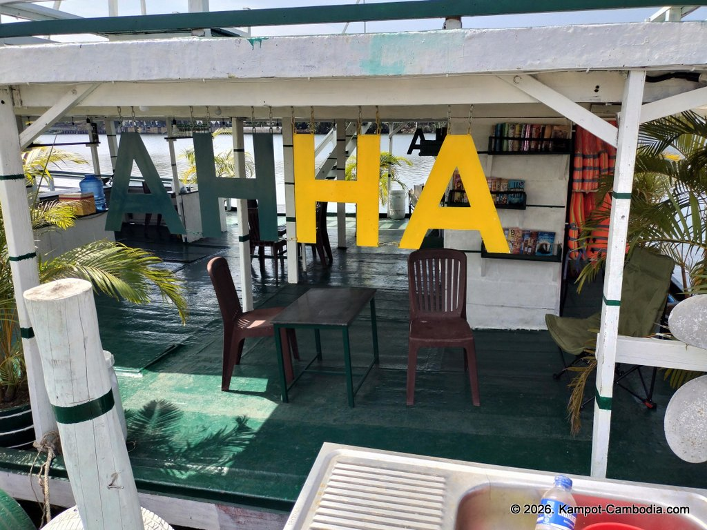 AHHA Floatel Library, hammocks, tents, cafe, kayaks on the Kampot River in Cambodia.