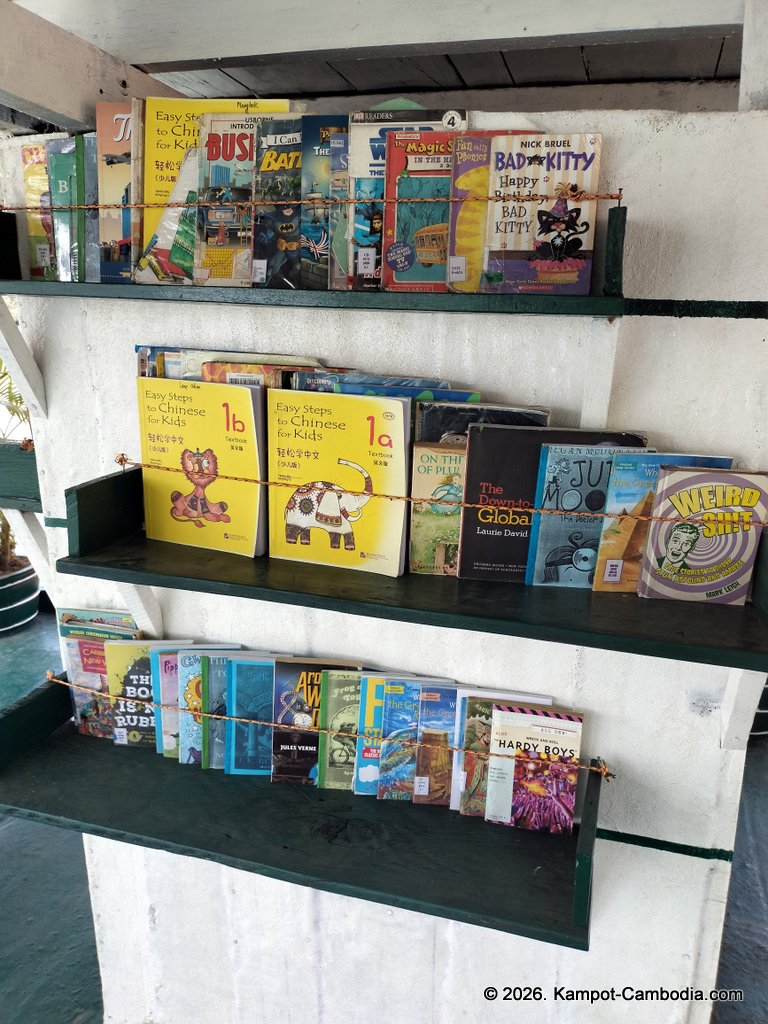 AHHA Floatel Library, hammocks, tents, cafe, kayaks on the Kampot River in Cambodia.