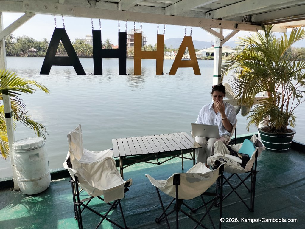 AHHA Floatel Library, hammocks, tents, cafe, kayaks on the Kampot River in Cambodia.