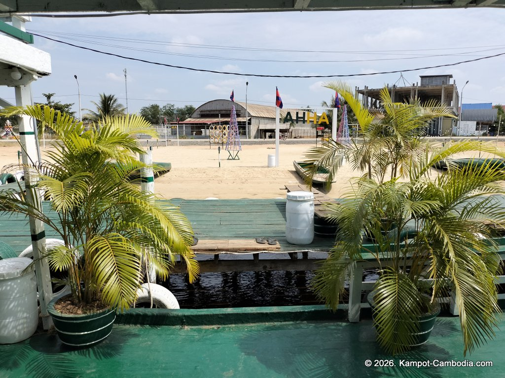AHHA Floatel Library, hammocks, tents, cafe, kayaks on the Kampot River in Cambodia.