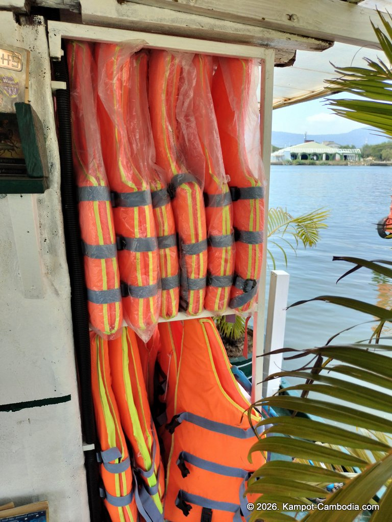 AHHA Floatel Library, hammocks, tents, cafe, kayaks on the Kampot River in Cambodia.