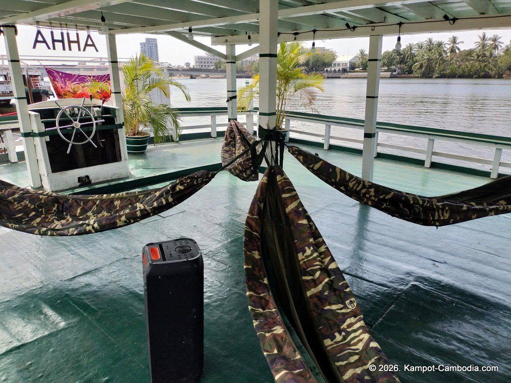 AHHA Floatel Library, hammocks, tents, cafe, kayaks on the Kampot River in Cambodia.