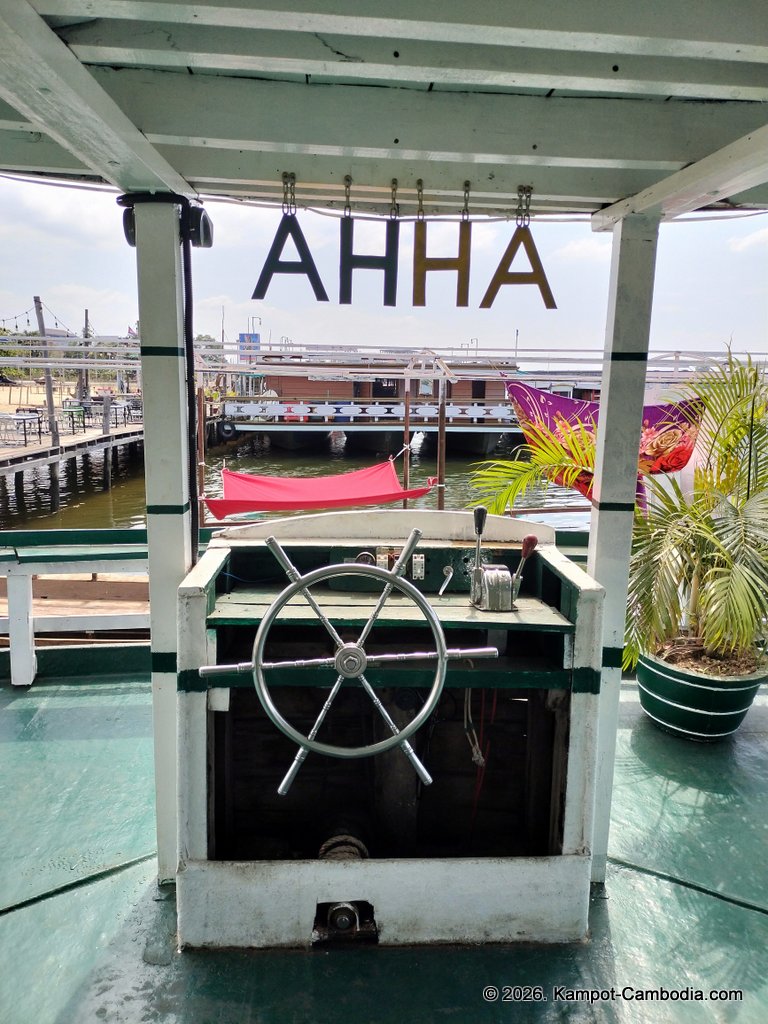 AHHA Floatel Library, hammocks, tents, cafe, kayaks on the Kampot River in Cambodia.