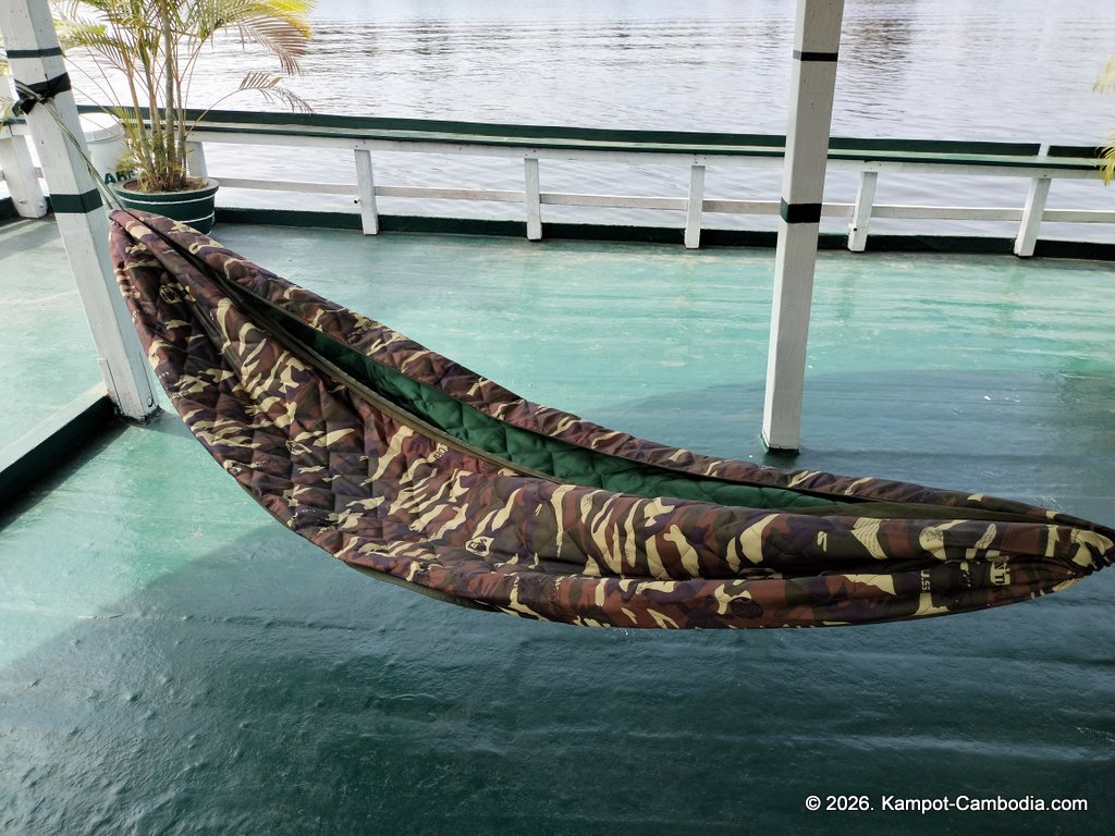 AHHA Floatel Library, hammocks, tents, cafe, kayaks on the Kampot River in Cambodia.