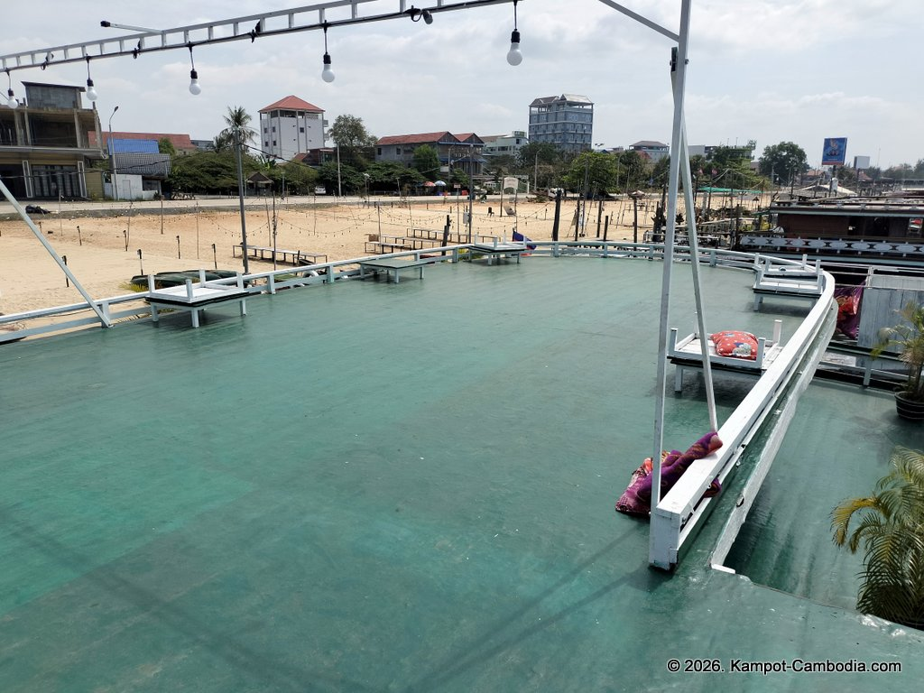 AHHA Floatel Library, hammocks, tents, cafe, kayaks on the Kampot River in Cambodia.