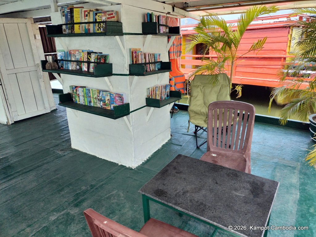 AHHA Floatel Library, hammocks, tents, cafe, kayaks on the Kampot River in Cambodia.