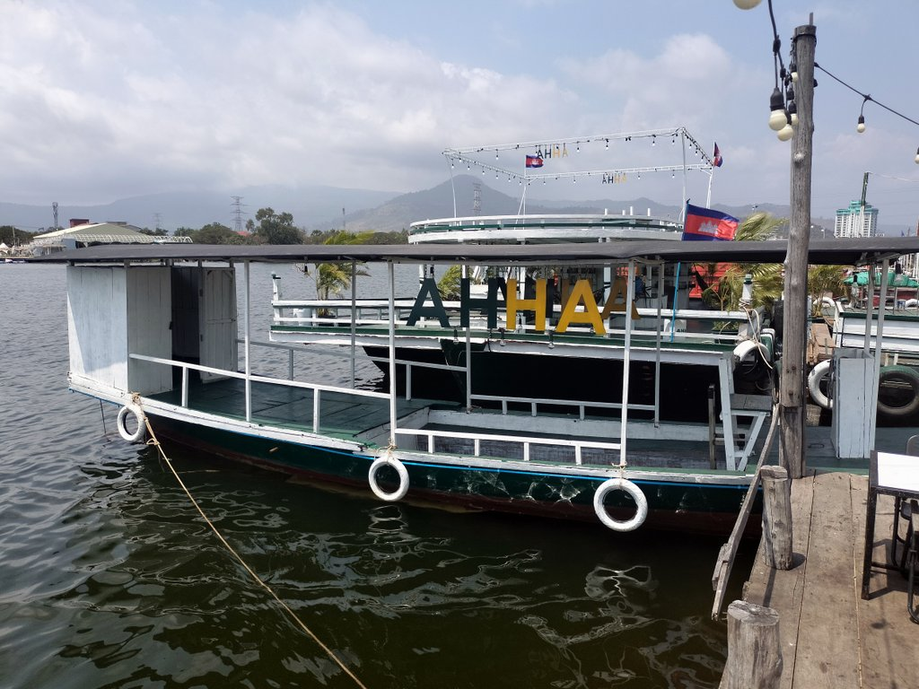 AHHA Floatel Library, hammocks, tents, cafe, kayaks on the Kampot River in Cambodia.